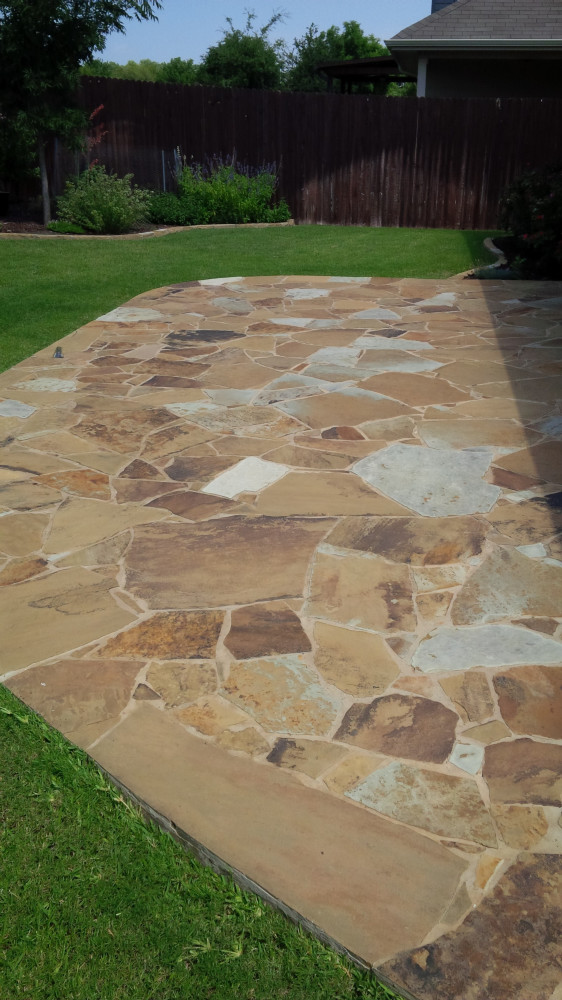Flagstone patio and weekly serviced lawn