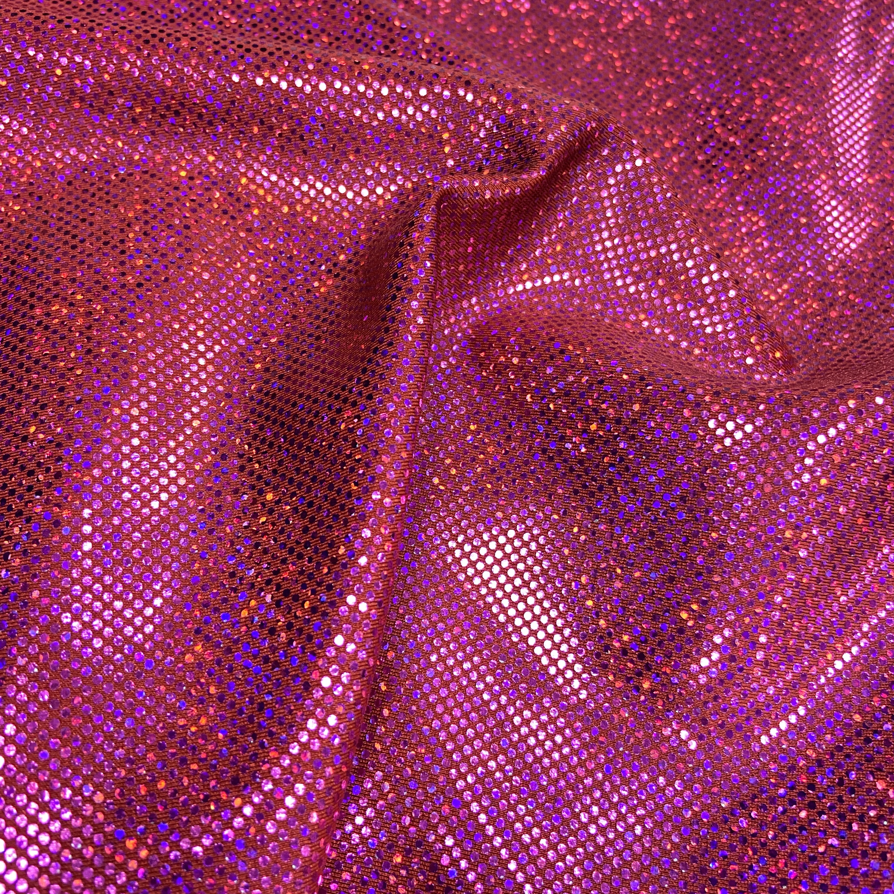 Pink sparkle hologram on red 