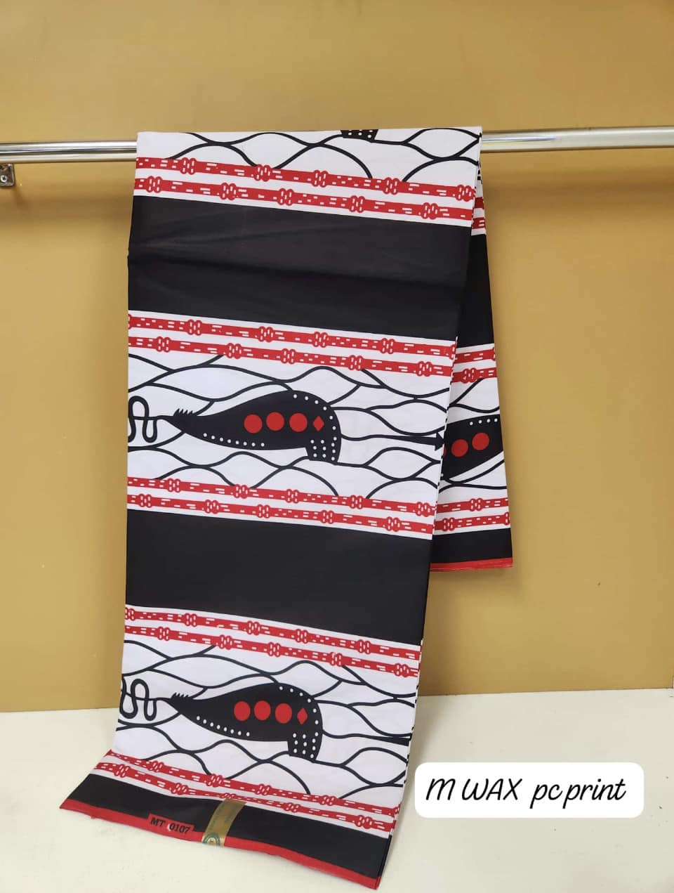 White, black, and red patterned fabric
