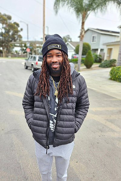 Man wearing a Rick Ross beanie