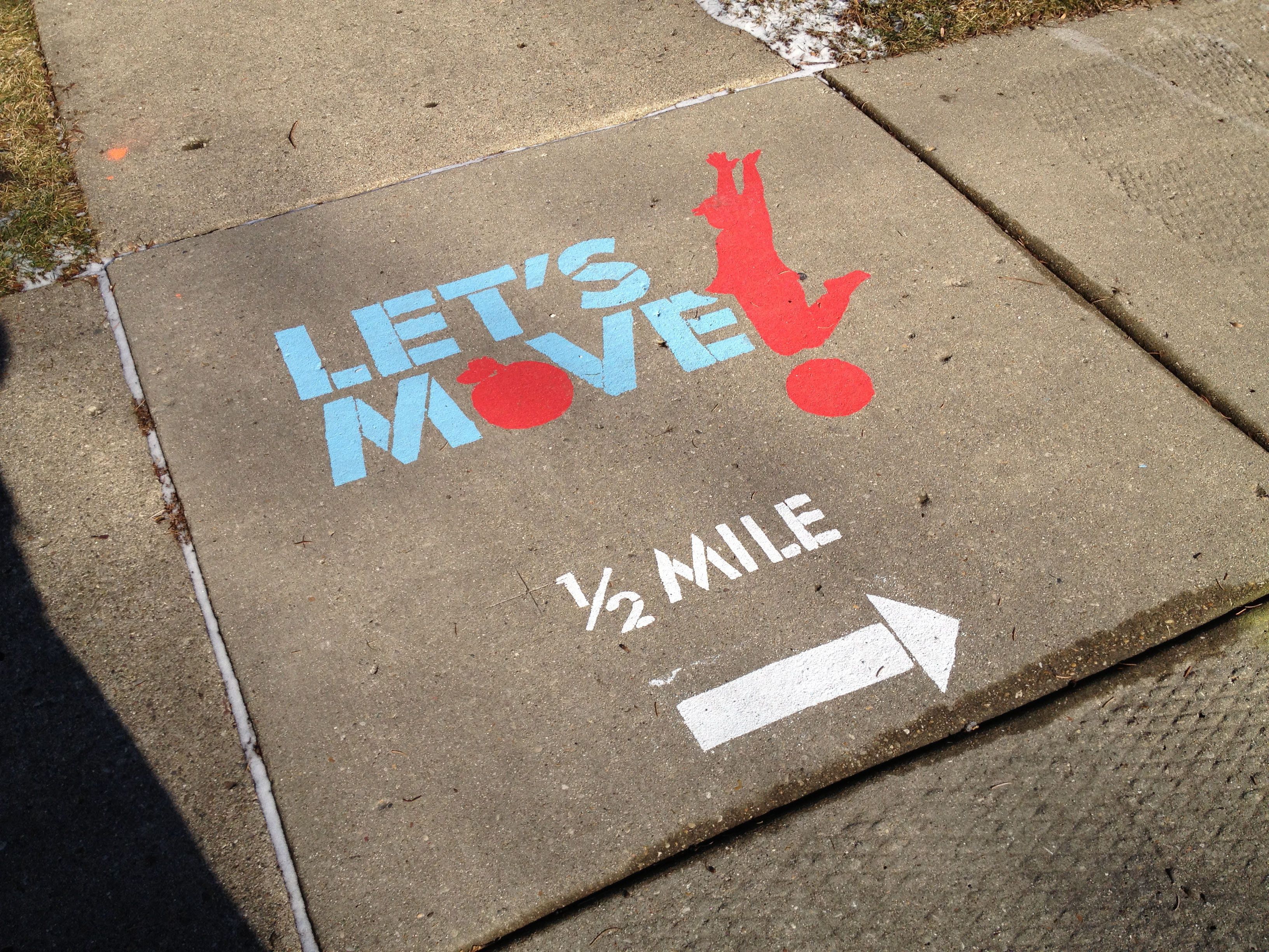 image of letters and images painted on sidewalk
