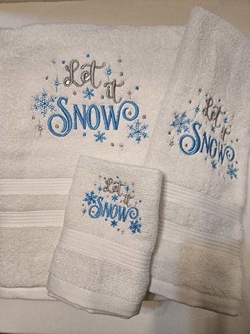 White towel set featuring a let it show design