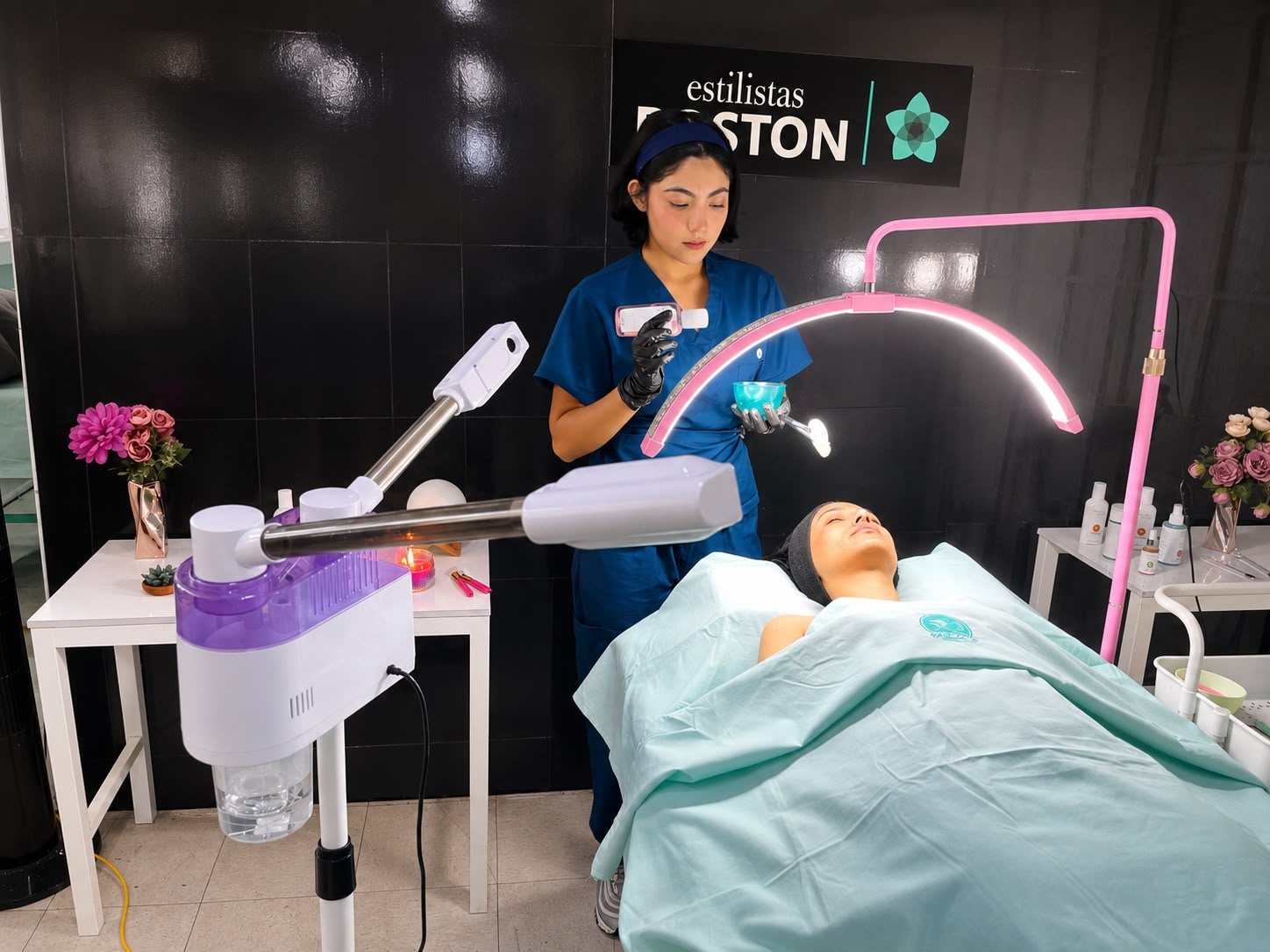 Modern luxury beauty salon interior with spa treatment beds, skincare products, mirrors, and staff serving clients
