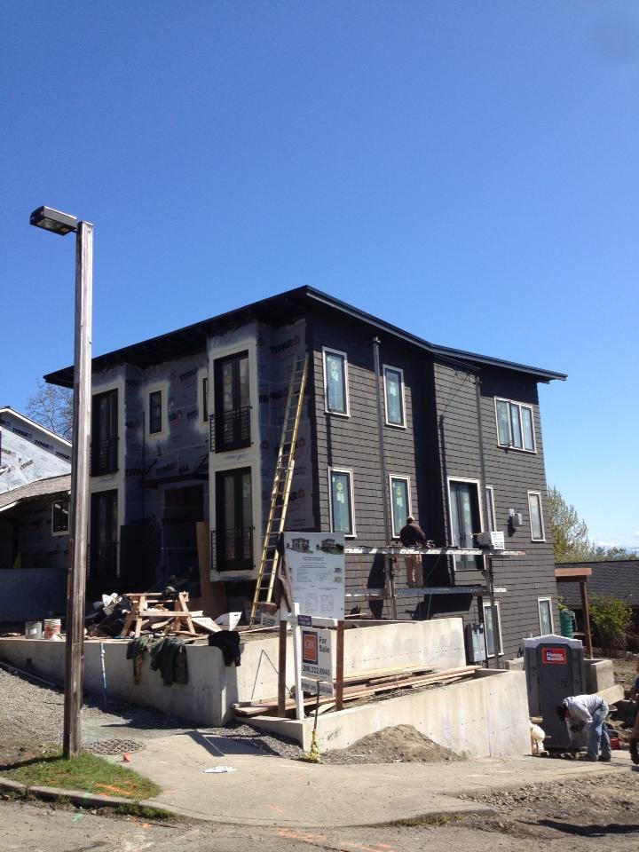 South Seattle. Here is a new construction home looking out over the 520 bridge, we installed pre stained cedar trim and shingles.