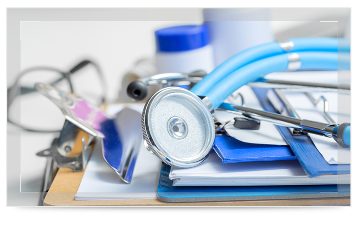 A stethoscope lying on a clipboard