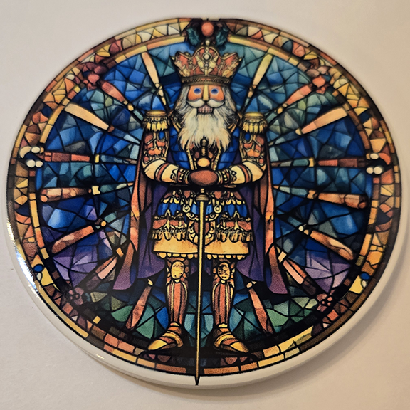 Round ceramic coaster with a stained glass nutcracker design