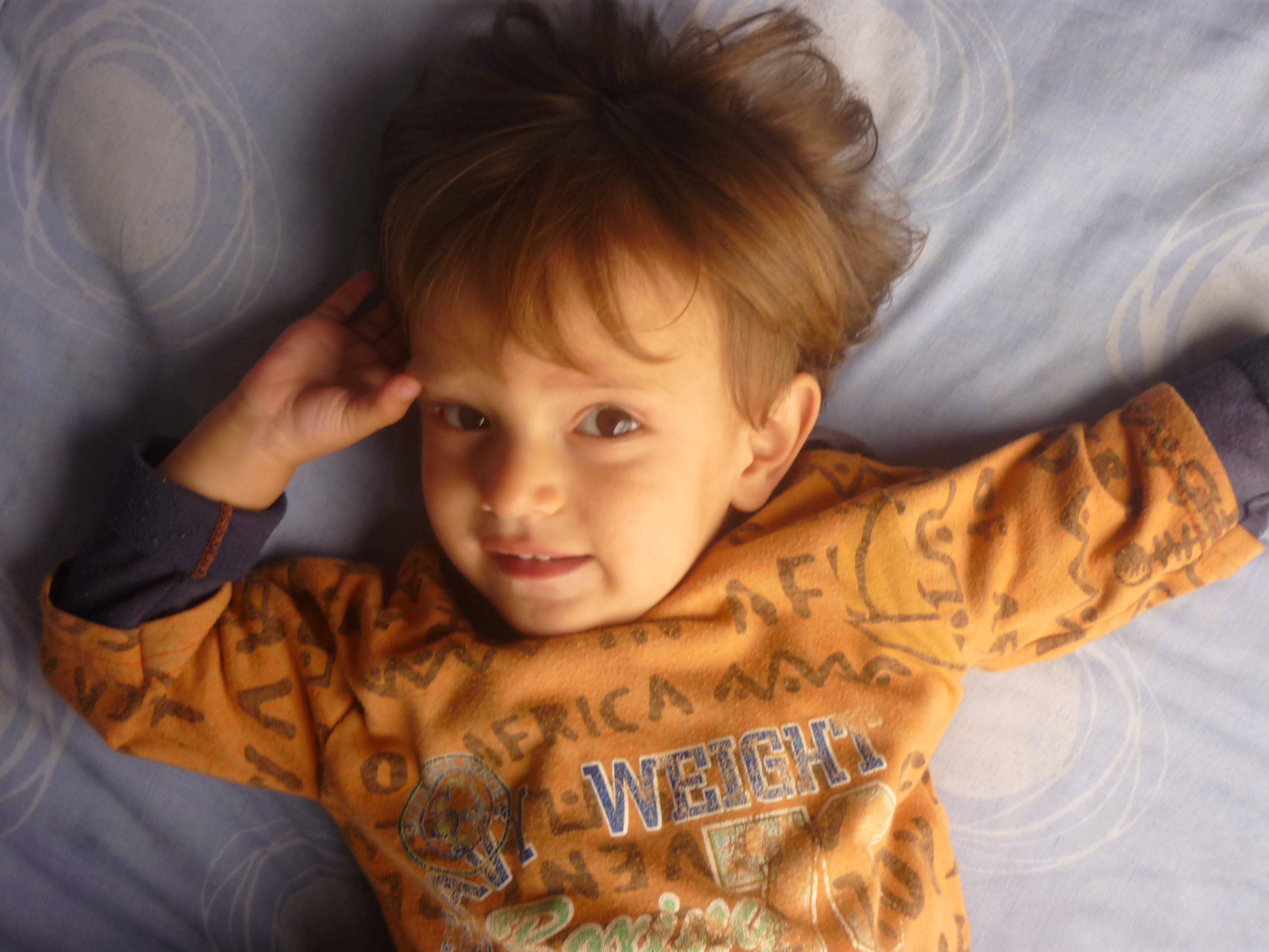 Elderly couple driving a convertible car