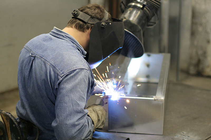 Welder welding metal box