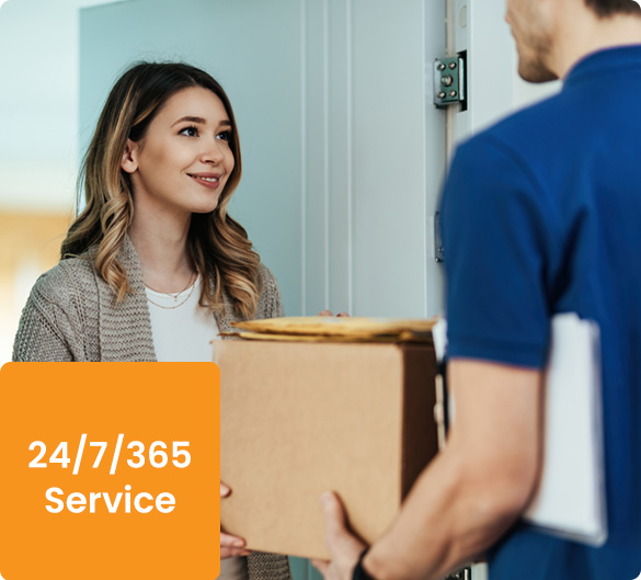 Smiling Woman Receiving a Package from Delivery Man