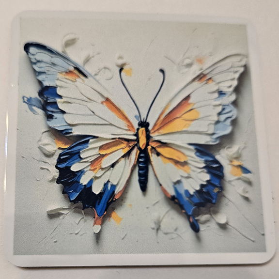 Square metal coaster with a painted butterfly design