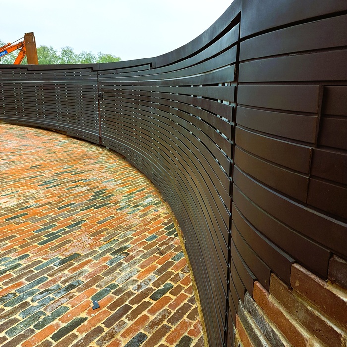 Chelsea Embankment London Artistic Metals AM bronze finish on roof panels and gate slats