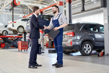 Hands over a car model