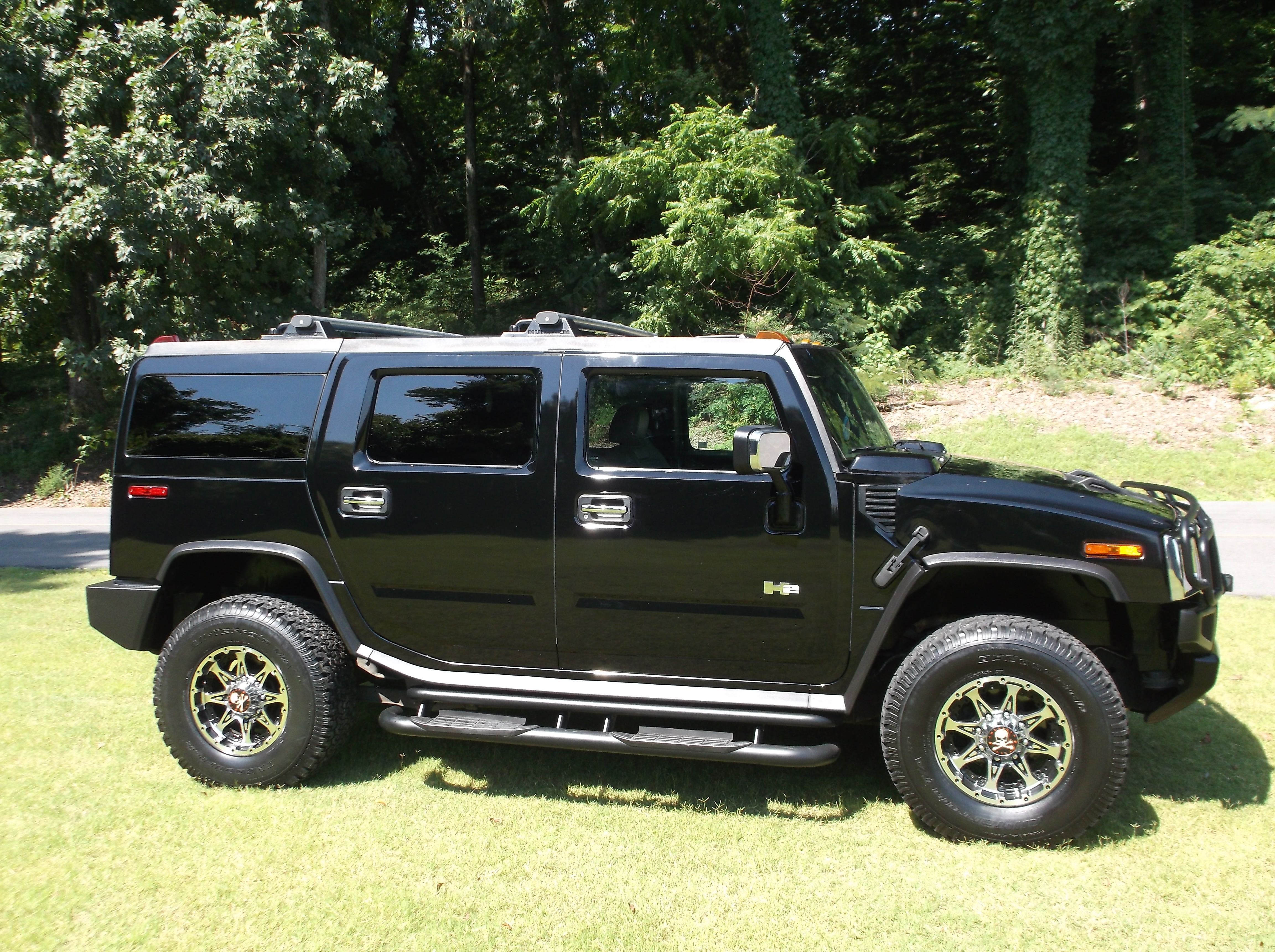https://0201.nccdn.net/4_2/000/000/064/d40/2003HummerH2Black_0080-4608x3440.jpg
