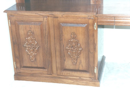 Left side of this unit houses
 pull out file and slide out drawers.