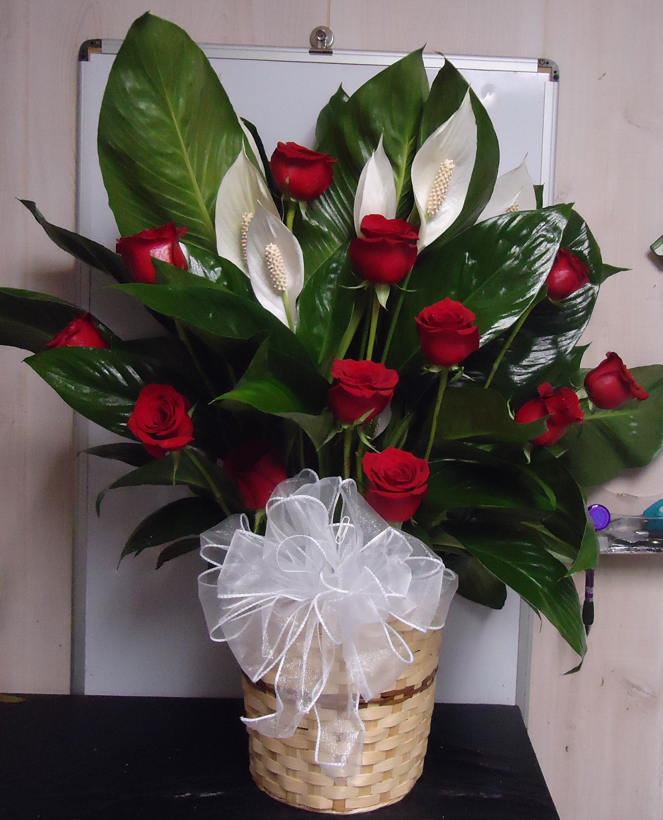 (27) Peace Lily Plant
W/ Dozen Red Roses
$160.00