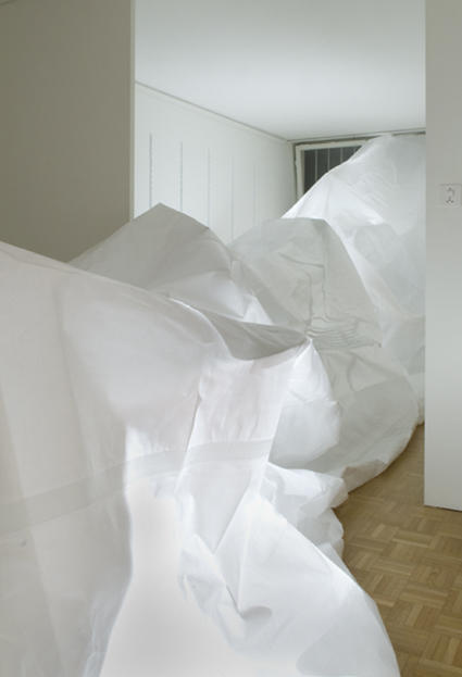 installation interior.
In my artistic work I create room-size installations and their photographic reproductions. I consider possibilities for staging new spaces over time. Here I use everyday materials such as tarps, styrofoam, soap or furniture. In my latest work I also employed acoustic recordings.
After creating the space, I focus on the relationship of the three dimensionality to the second
dimension, namely photography. If the two-dimensional image reproduces an accurate image
of part of reality, the 3D object in its totality is hardly caught, but only experienced. This dialectic
between experience and depiction highly interests me.