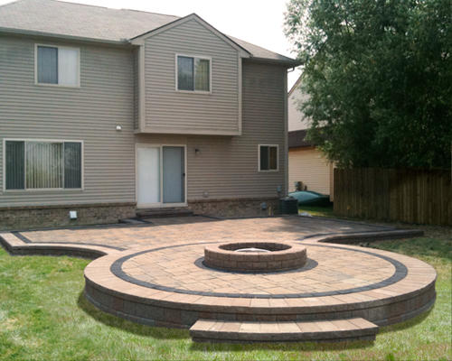 Raised patio with built in fireplace and uni granite accents