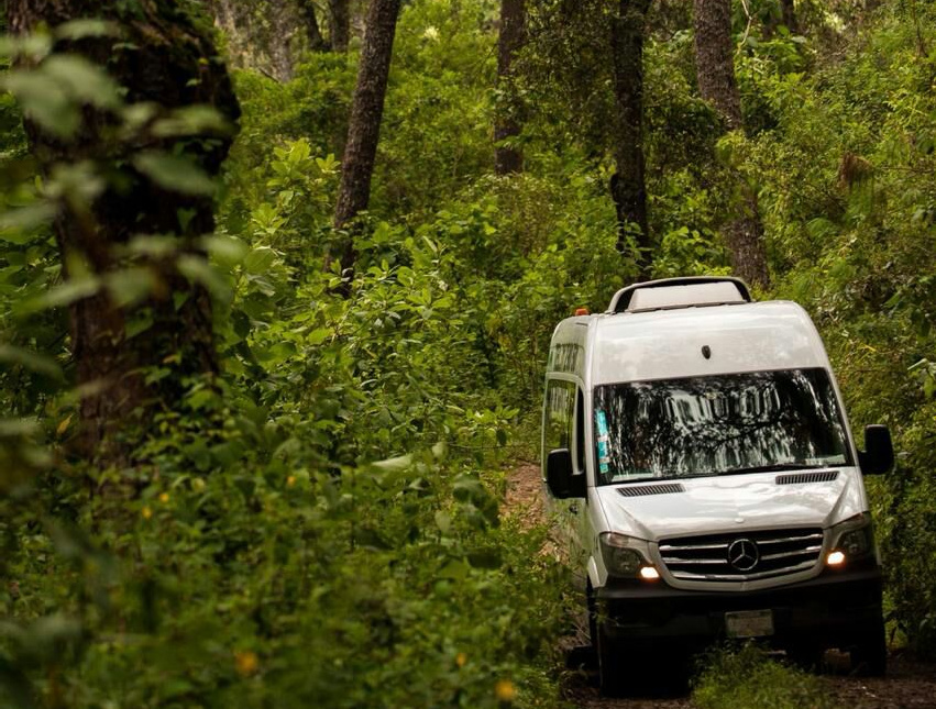 Young athletic man exercising in the rain