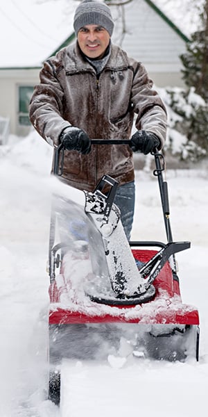 Man Clearing Driveway of Snow
