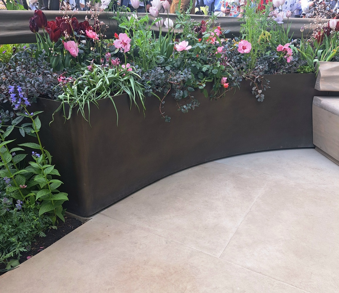 Aged brass finish AM.4 in the Parkinson's UK garden at Chelsea 2026