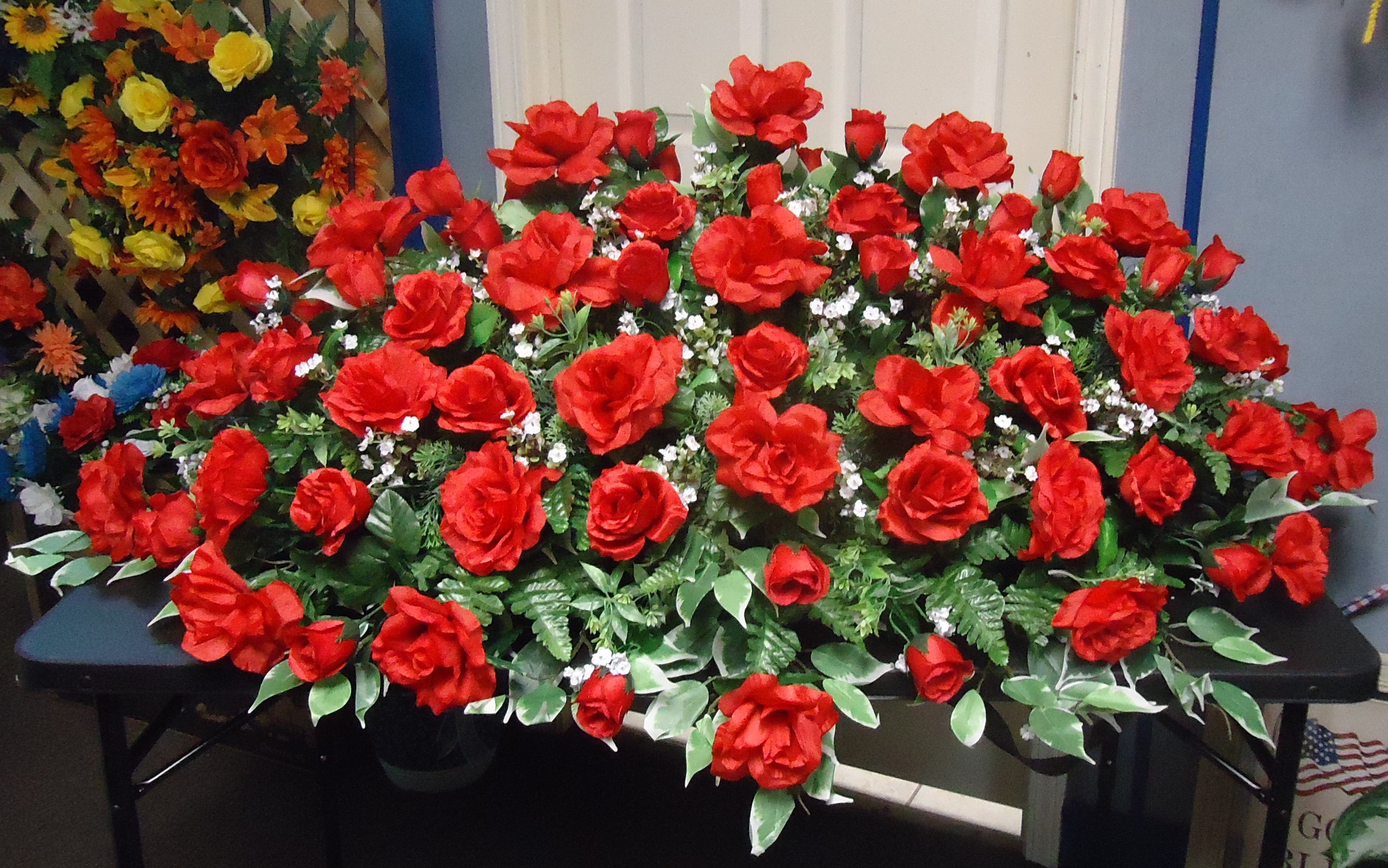 (20)  &quot;AMAZING RED&quot;
Double &quot;Silk&quot; Casket Spray
(Red Roses)
$650.00