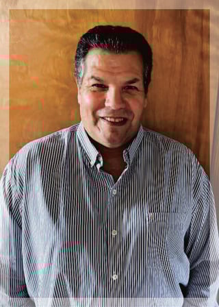  A photo of Ken smiling at the camera