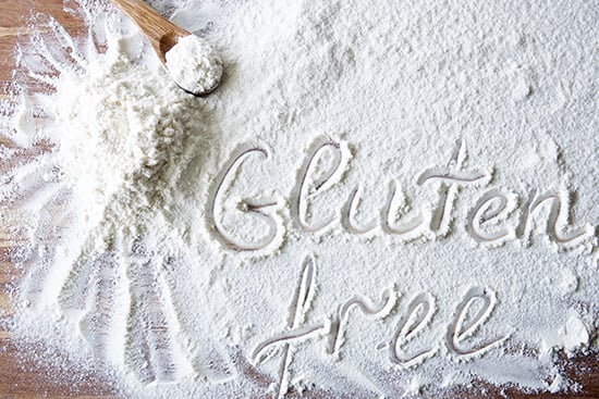 Word Gluten Free On Wood Board With Flour