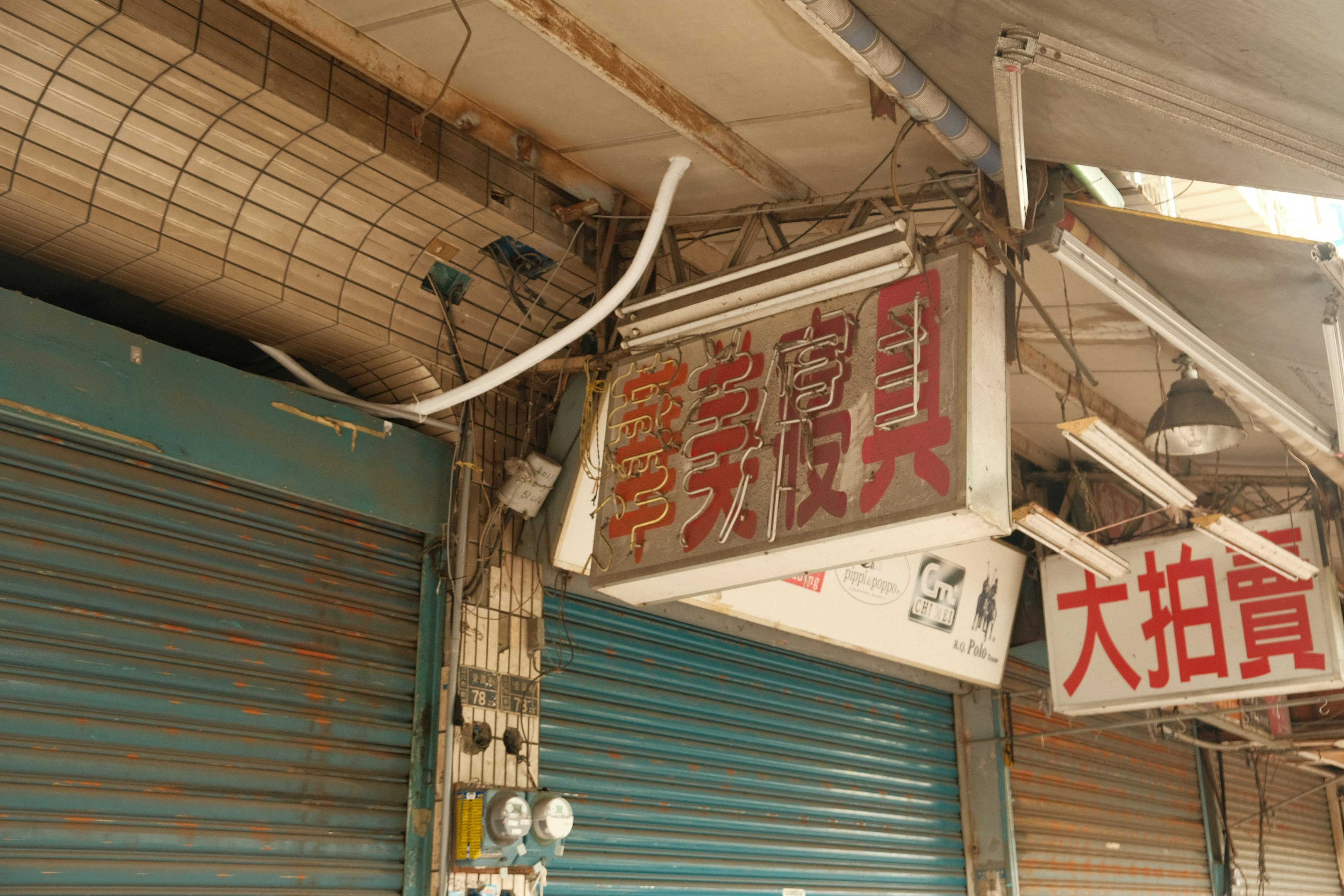a sign hanging from the side of a building