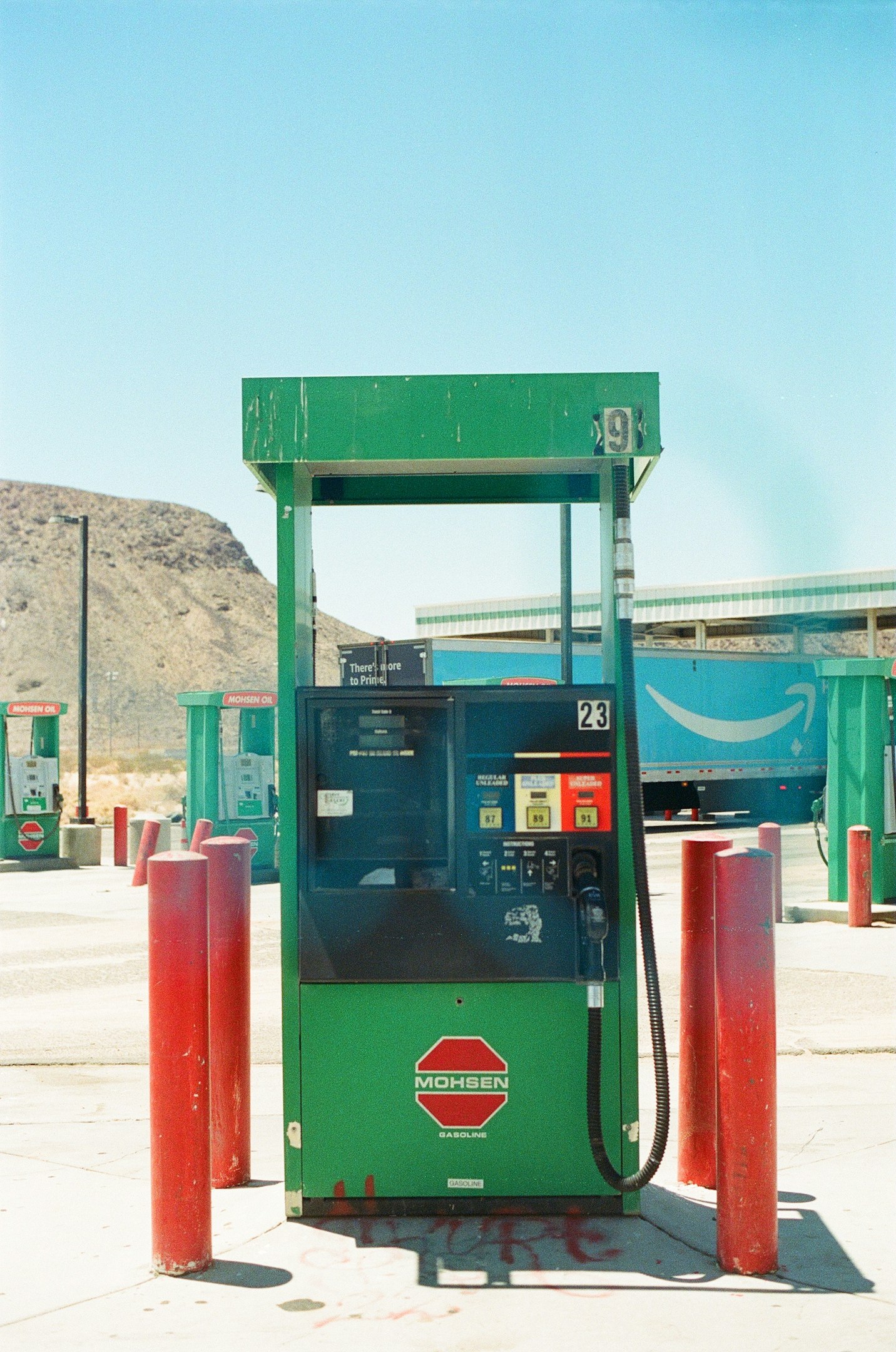 a blue and green gas station
