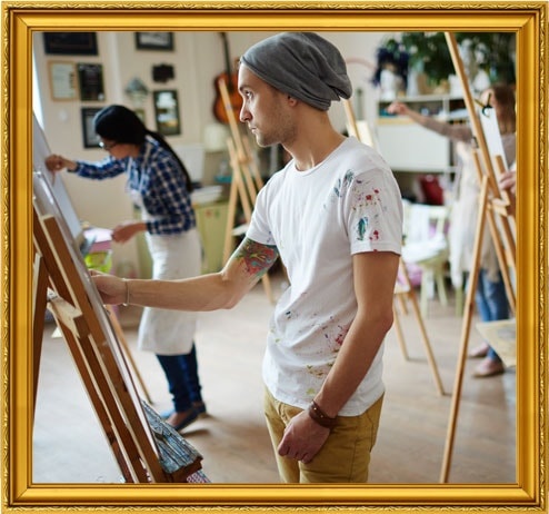 Artists Painting In Workshop