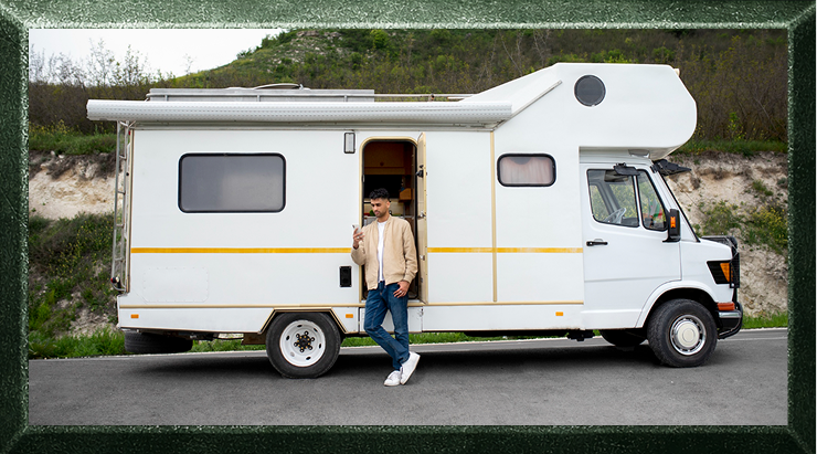 A man standing by a white camper van