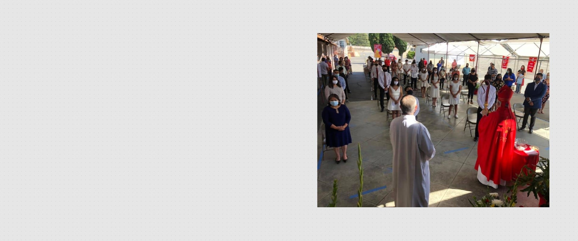 Outdoor religious ceremony with socially distanced attendees wearing masks, led by clergy in red and white robes.