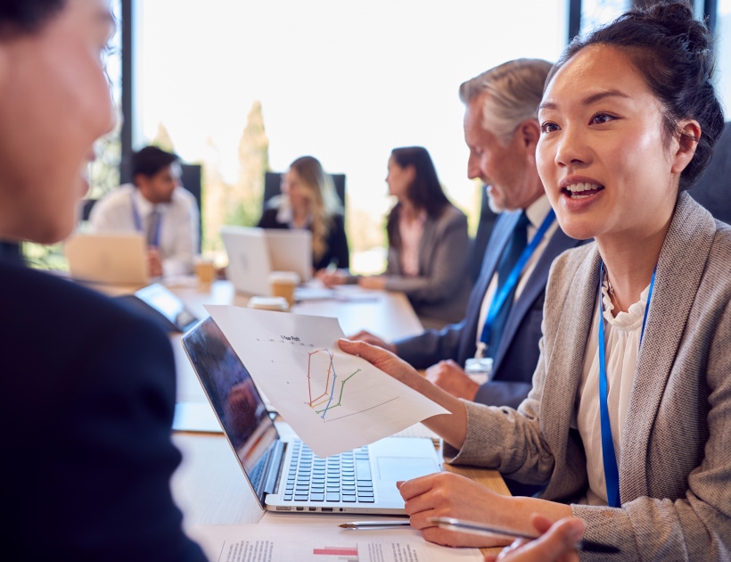 A meeting with several people at a table