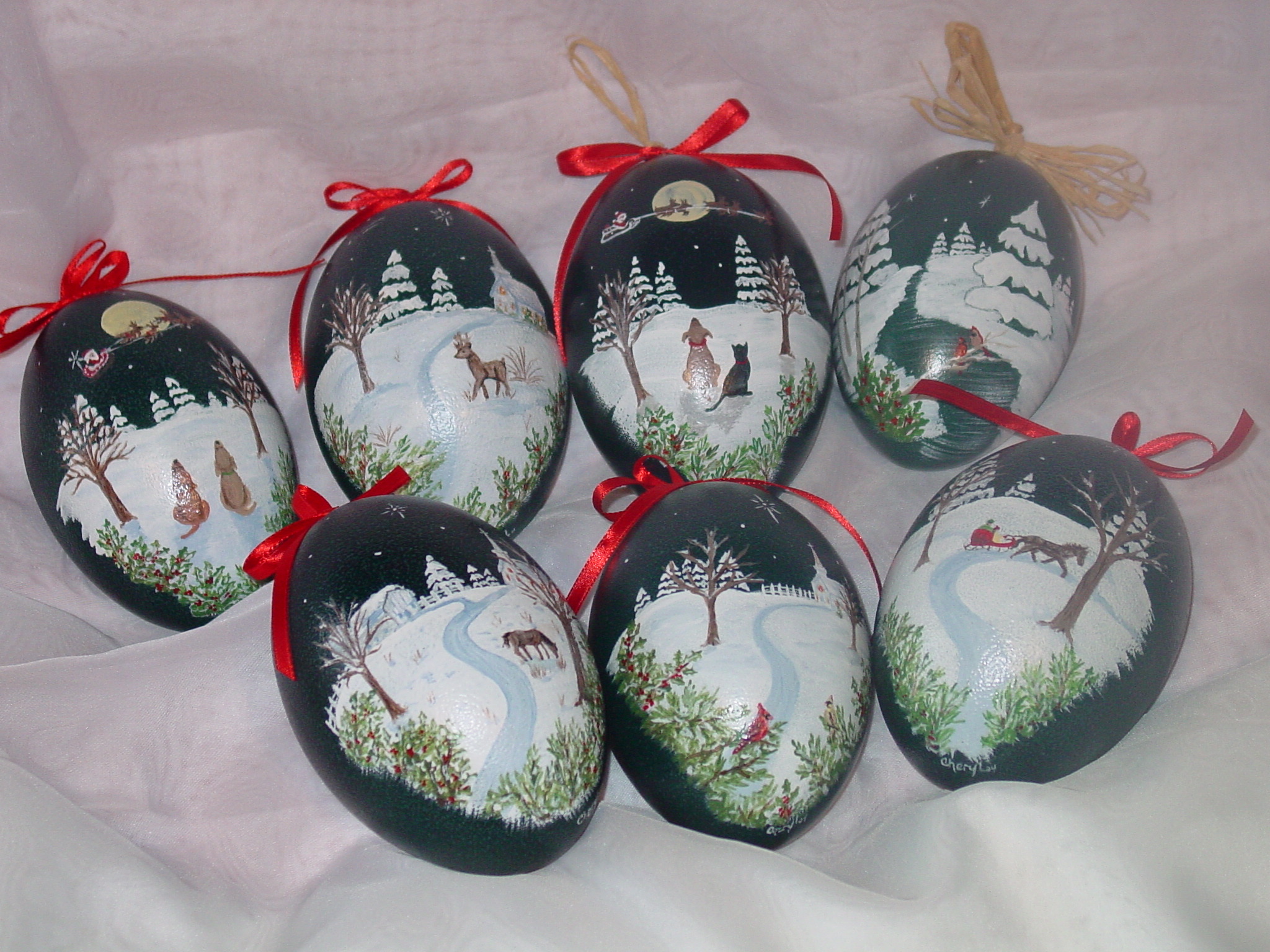 Holiday Painted Emu Eggs - Emu eggs are these lovely blue-green color. The hand paintings are covered with shellac to preserve the paintings for years to come, so they can be displayed each holiday season.