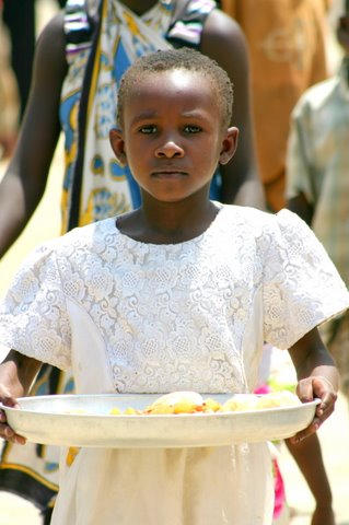 "Hope Grows Here" - The dispair on a starving child's face as she gets her one square meal for the week. 