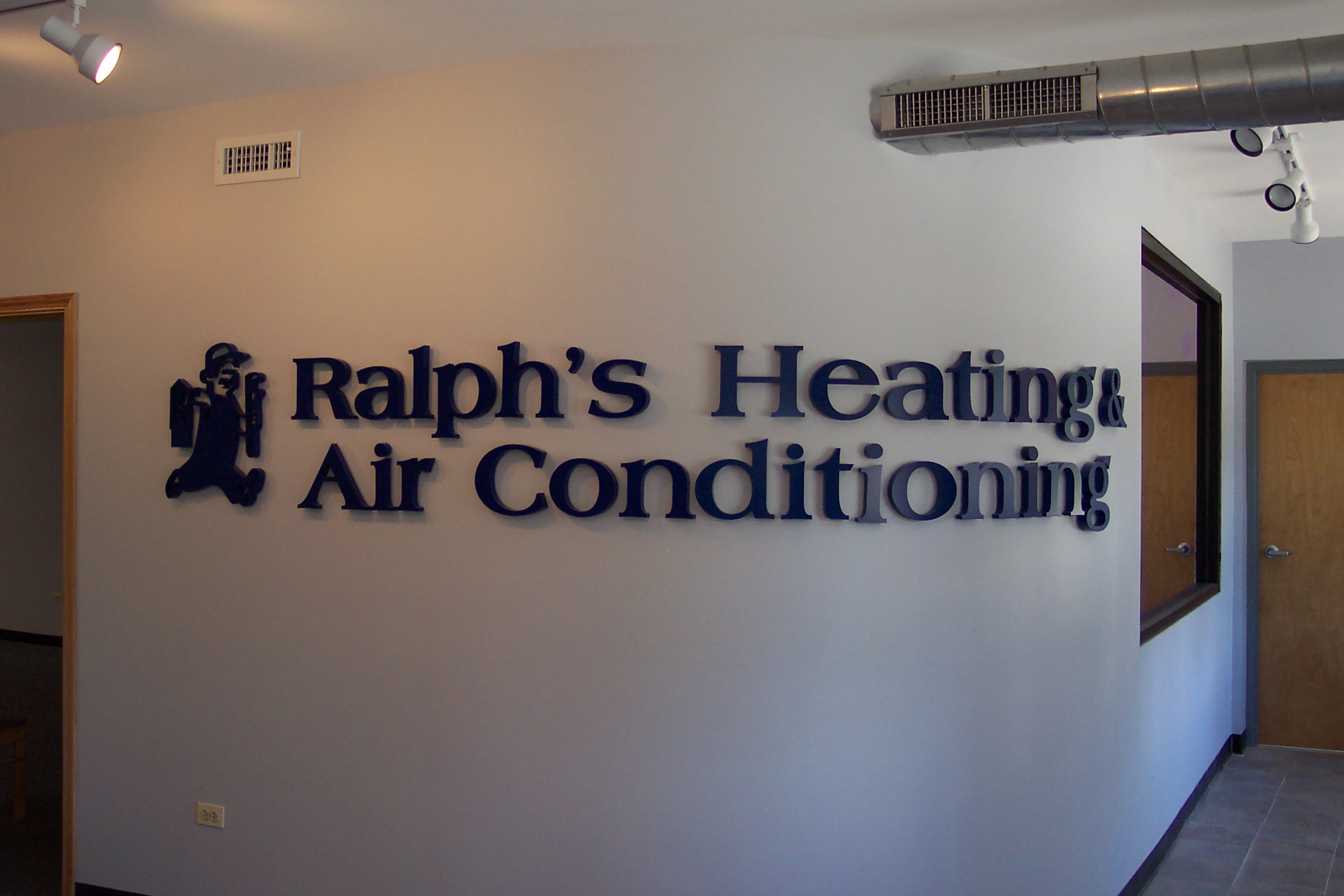 laser cut acrylic logo and lettering reading Ralph's Heating & Air conditioning