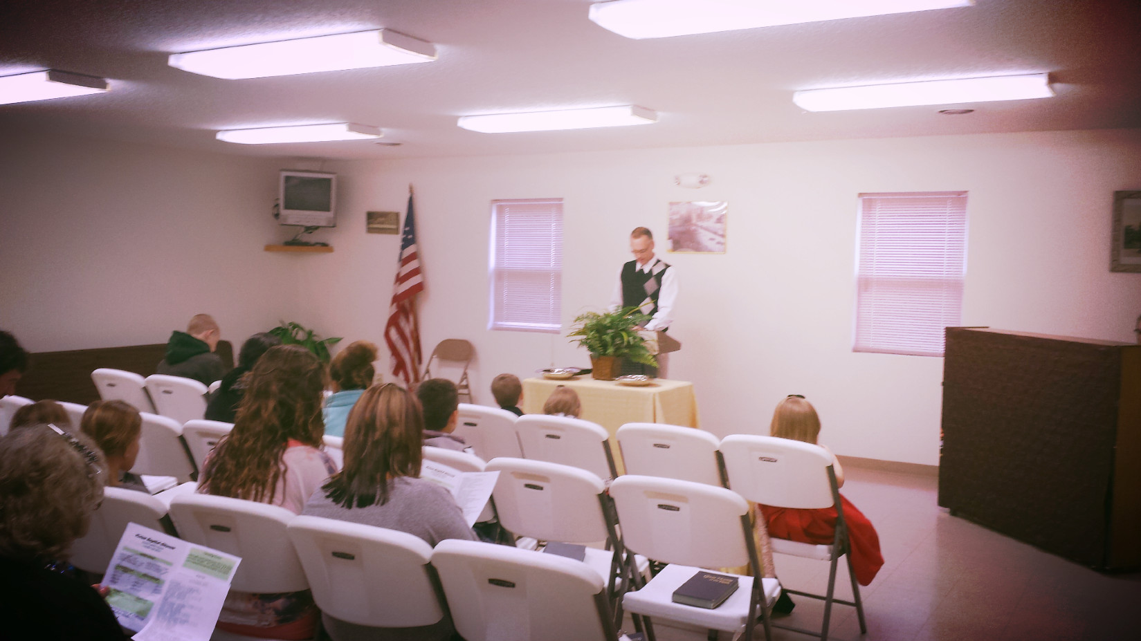 Brother Aaron Newton giving announcements.