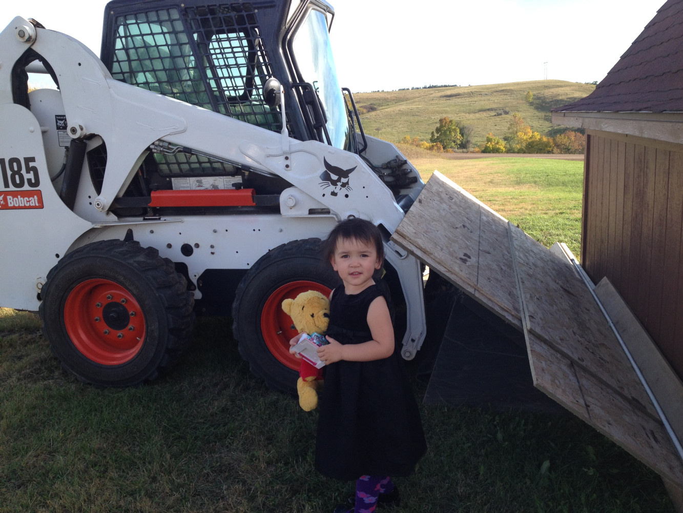 Miss Lydia ready to drive the Bobcat