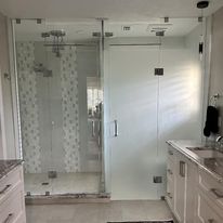Frameless custom enclosure w/ clear and etched glass, custom hardware. Installed by Pierce Lindsey Glass.