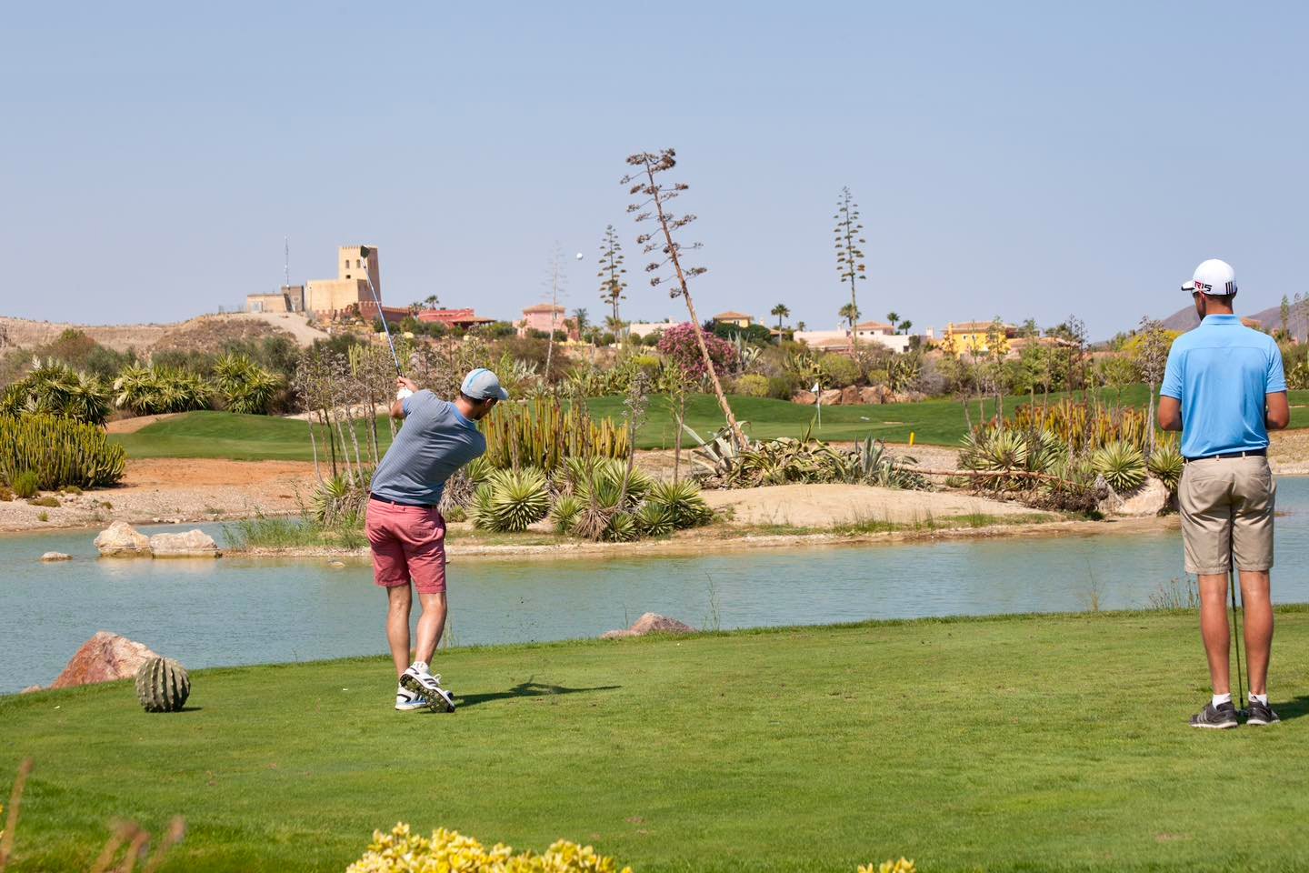 a person holding a golf ball in their hand