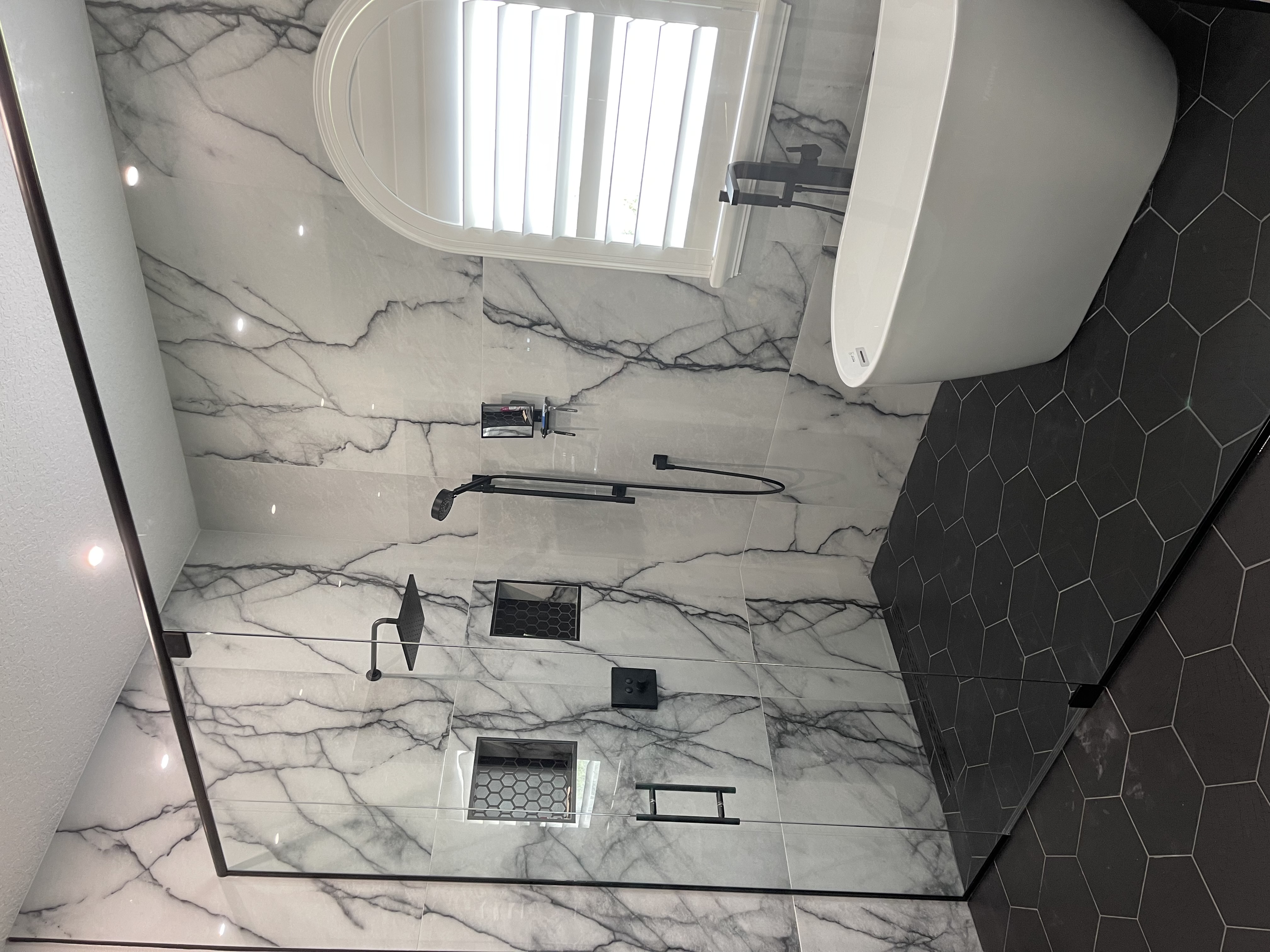 Custom 3/8" frameless "wet room" enclosure, black metal