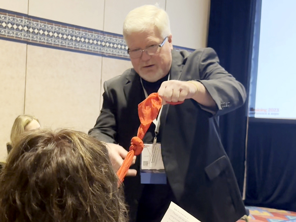 Chuck involving one of his corporate class participants in a magical performance that supports the learning material. Chuck involving one of his corporate class participants in a magical performance that supports the learning material.