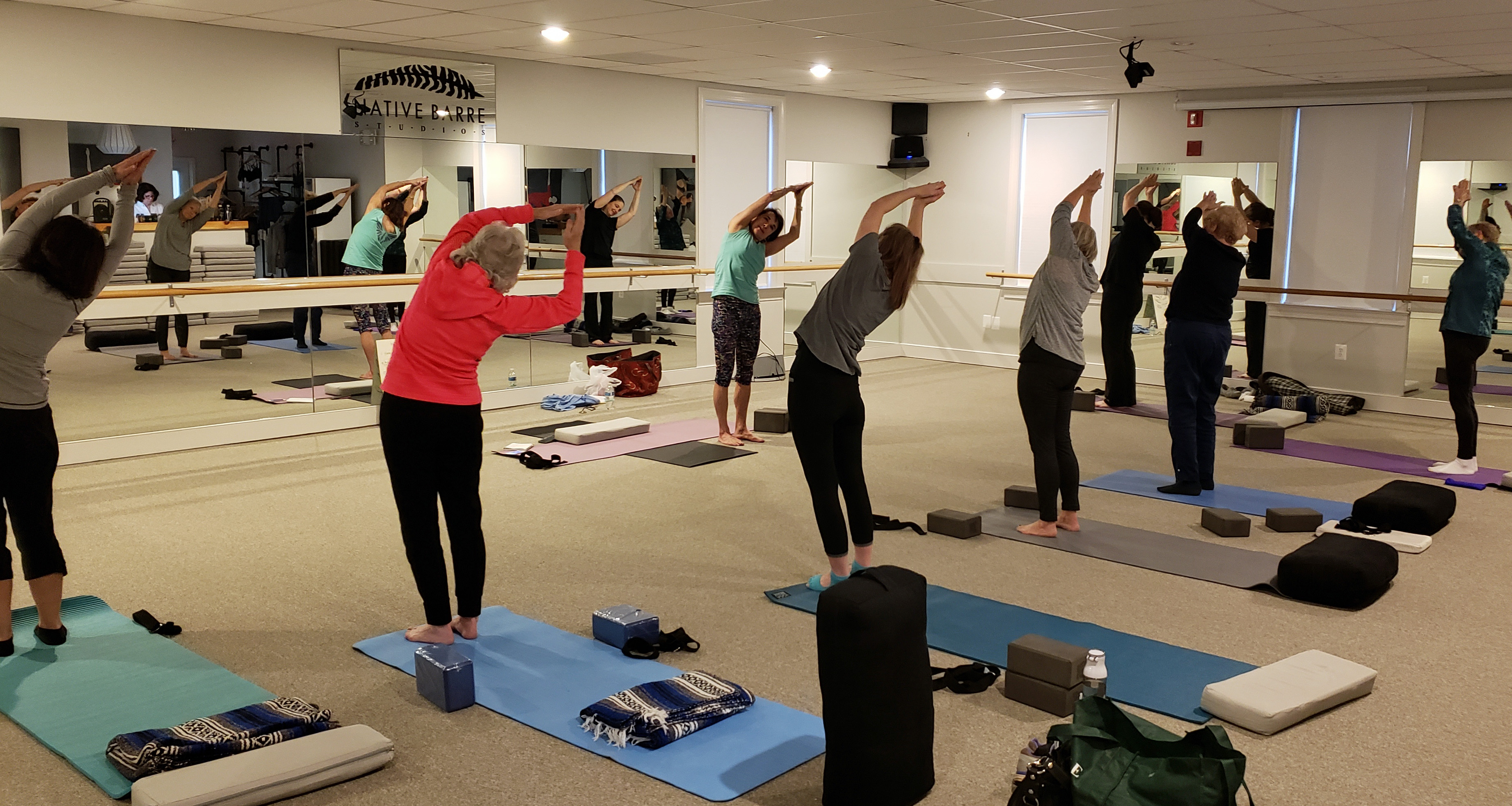 man in gray crew neck t-shirt sitting on green grass field