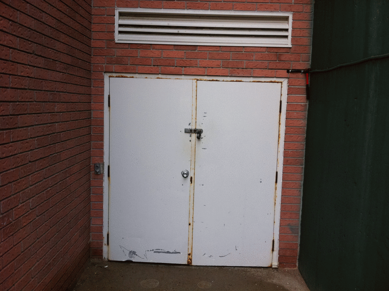 Photo of door before remove and reinstall of new door and frame 