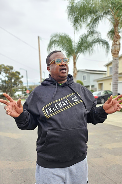 Man wearing a Rick Ross hoodie