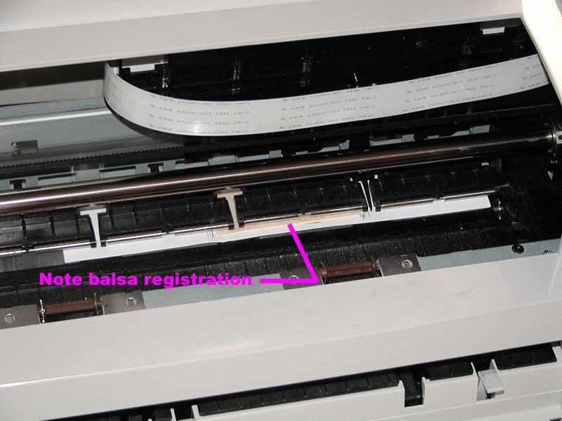 From the front of the printer, you can be sure the balsa and backing sheet are properly registered. We have taped down the micro switch that detects the lid is open so the print head does not move to the center of the printer.