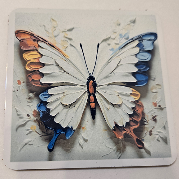 Square metal coaster with a painted butterfly design