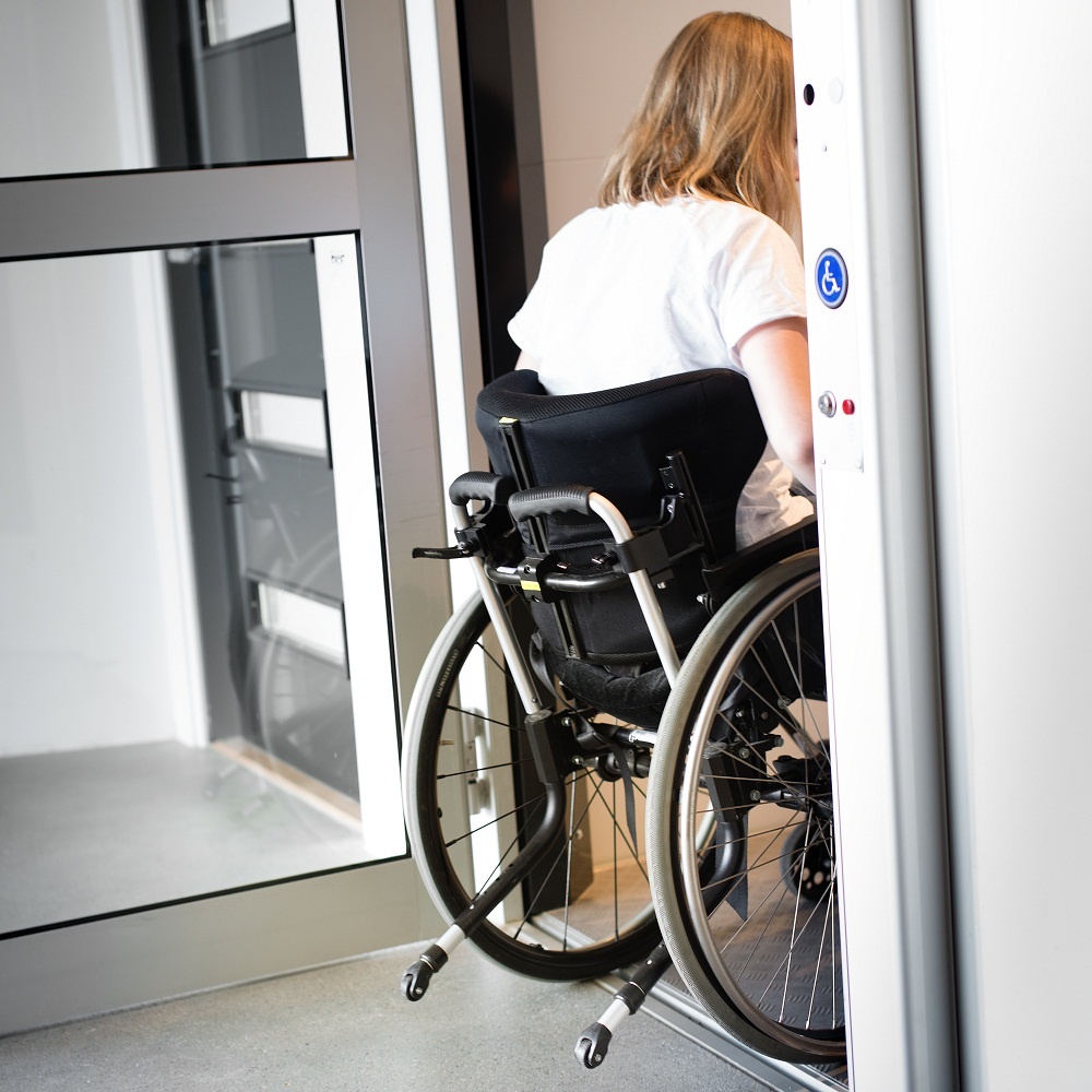 Old Lady on Wheelchair Using Lift