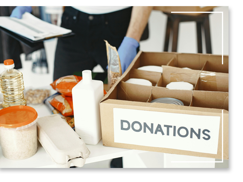 Box labeled "DONATIONS" with food items
