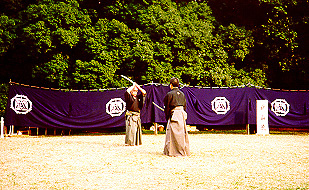 1992. Meiji Shrine. Sato Shimeo Sensei (L) and Suzuki Kunio Sensei (R) performing Kumitachi at the annual Budo exhibition sponsored by the Nippon Kobudo Shinkokai.